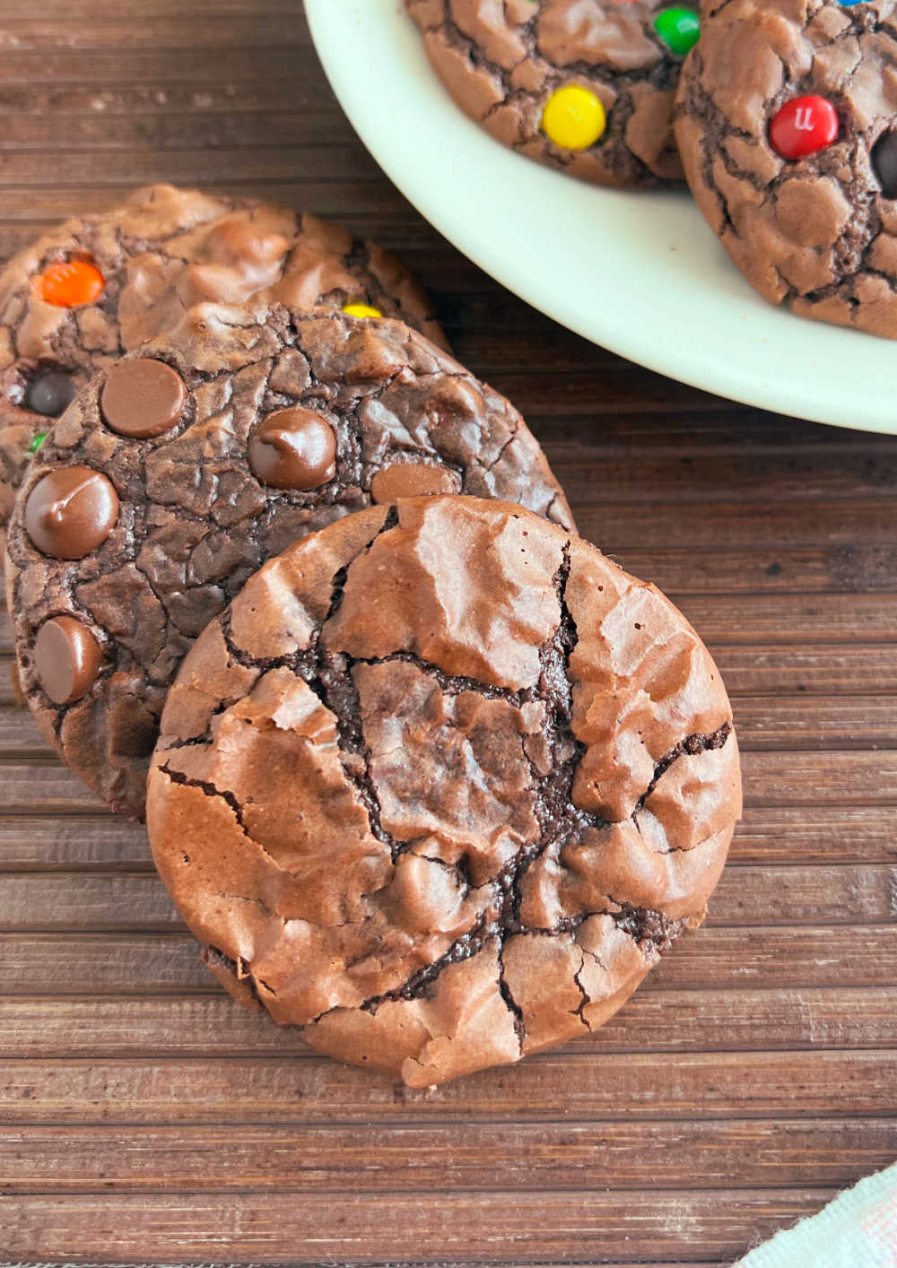 close up of fudgy crinkle top brownie cookies.