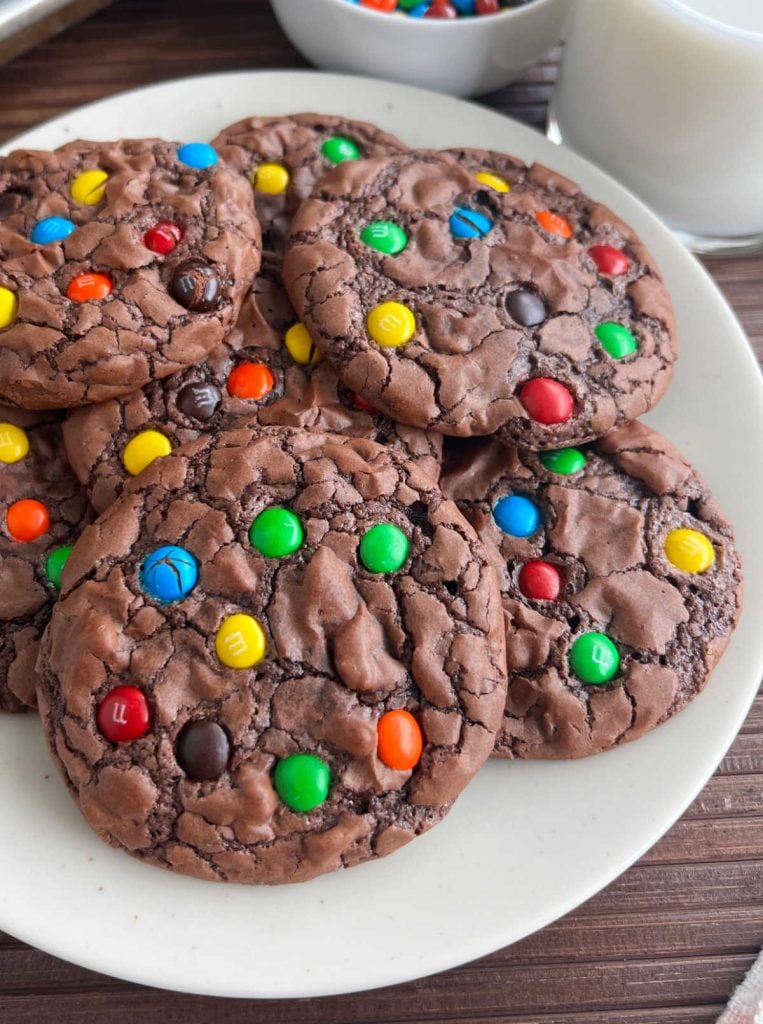 brownie cookies with m&m's minis on a plate.