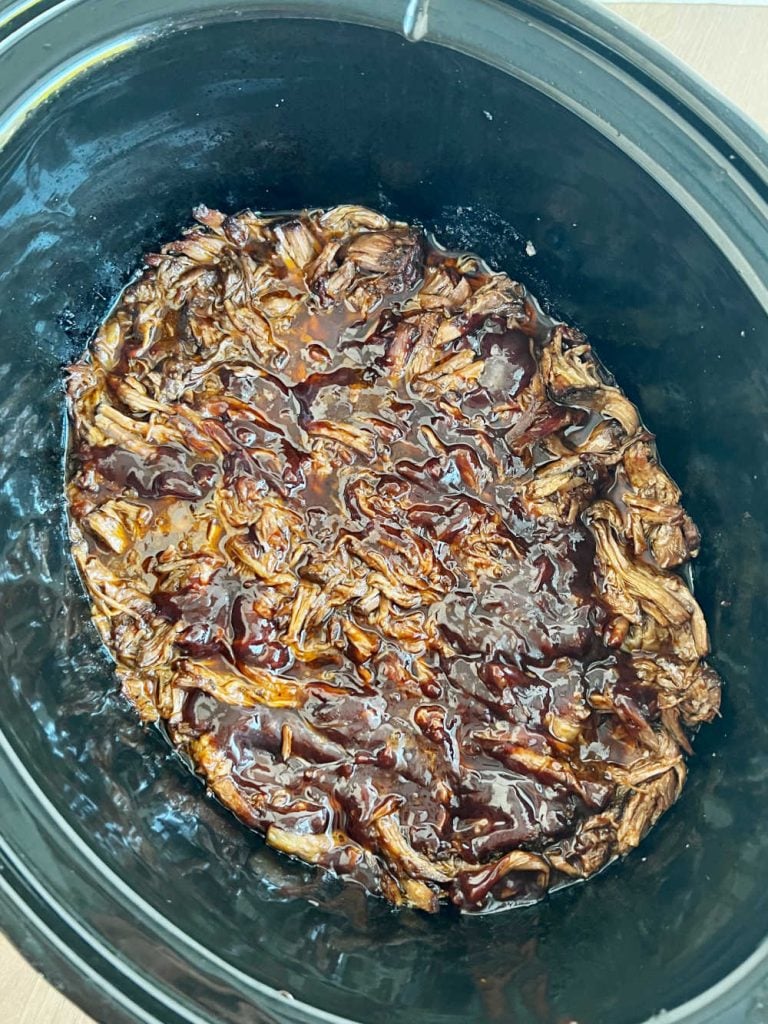 shredded bbq beef in slow cooker.
