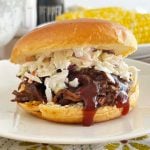 crock pot bbq beef sandwich with coleslaw on a bun.