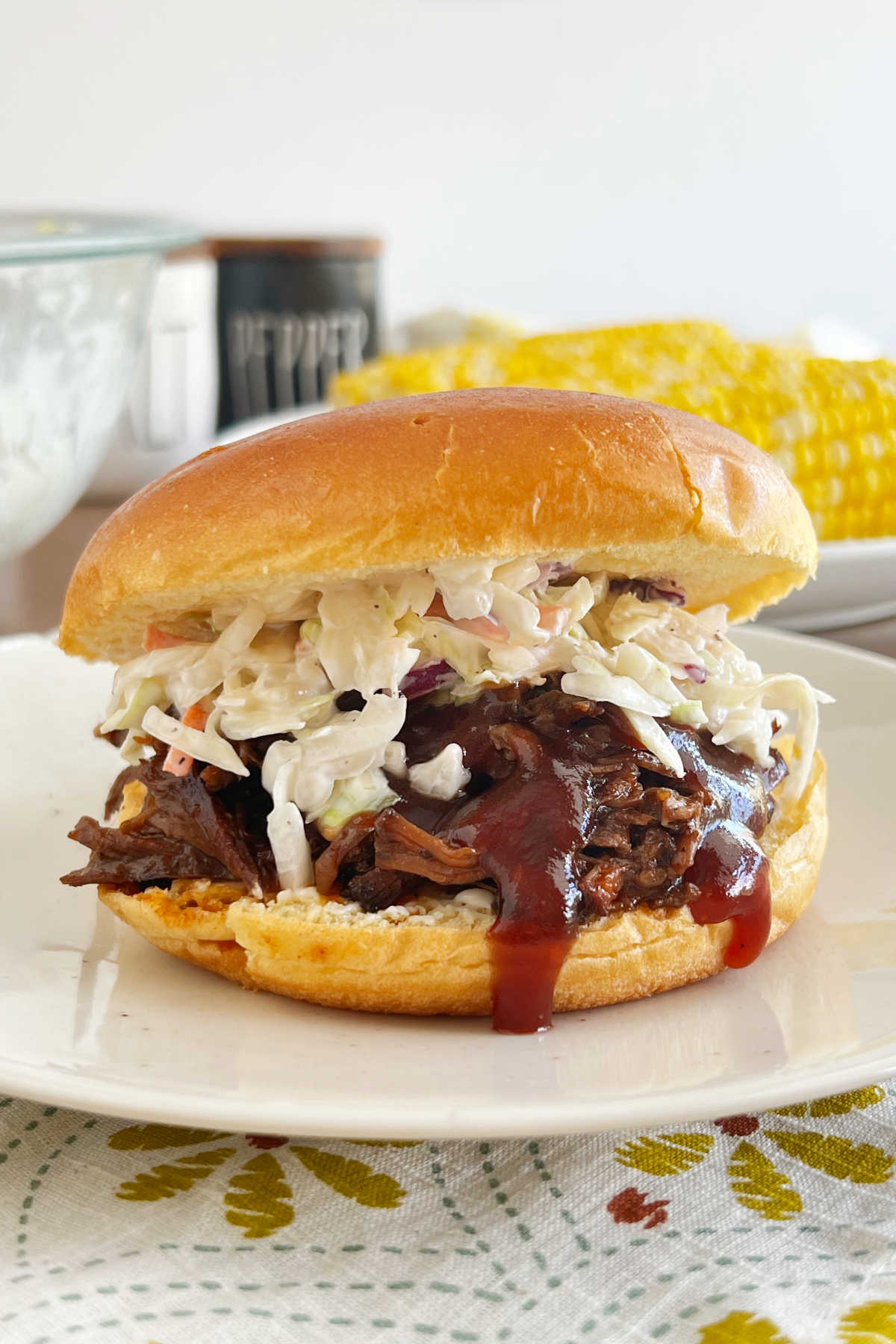 crock pot bbq beef sandwiches on bun with coleslaw.