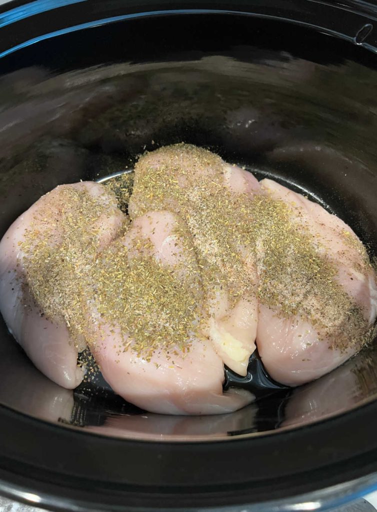 chicken with Italian seasoning in the slow cooker.