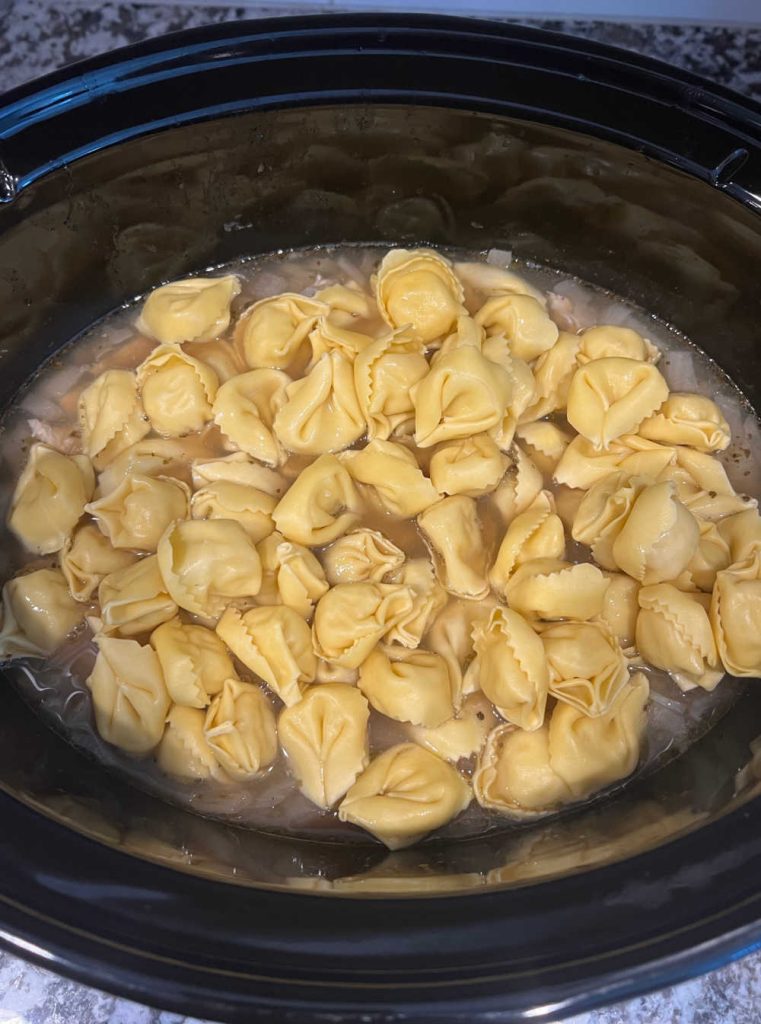fresh tortellini soup in crockpot.