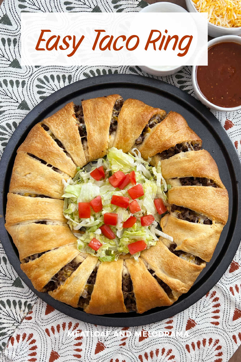 This Easy Taco Ring Recipe with Crescent Rolls is an easy dinner or appetizer made with taco meat baked in crescent roll dough. A family favorite perfect for Taco Night! via @meamel
