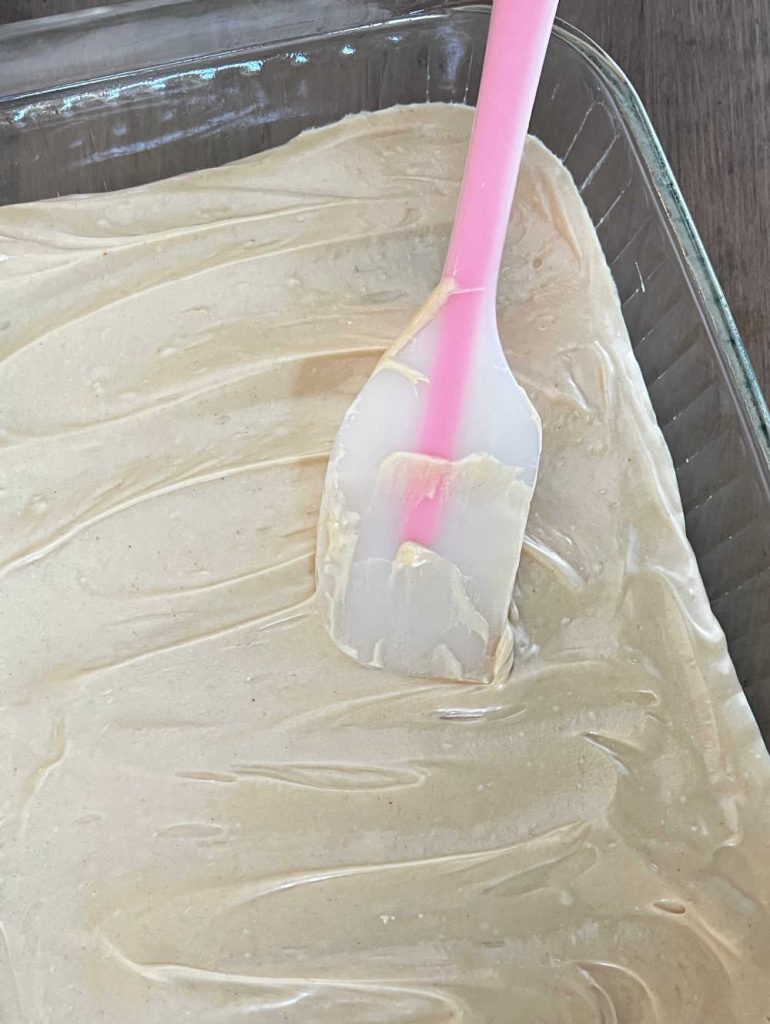 spread frosting over bars with spatula.
