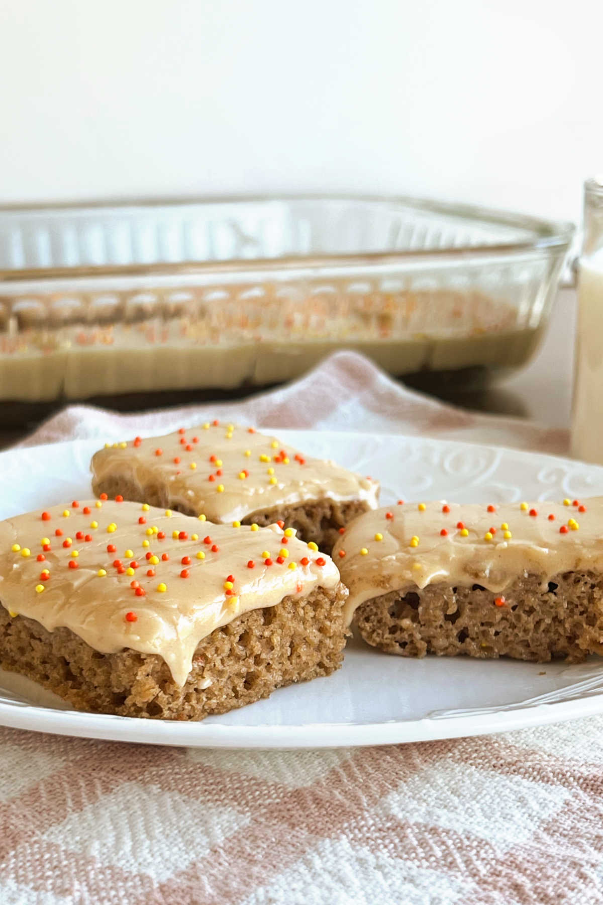 easy applesauce bars with peanut butter cream cheese frosting on plate.