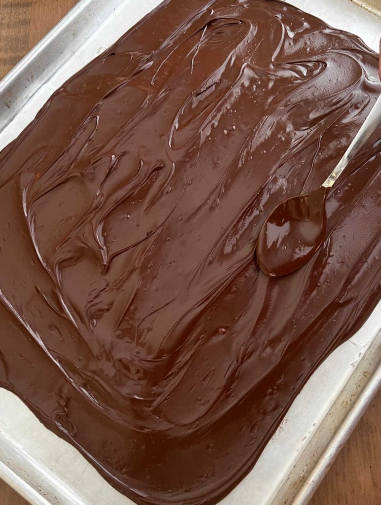 melted chocolate on wax paper sheet pan.