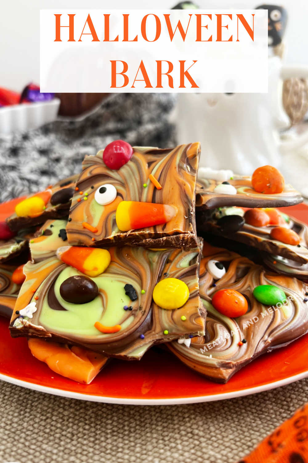 Easy Halloween Candy Bark is an easy Halloween dessert made with melted chocolate, candy melts, candy corn and your favorite candies. Perfect for a Halloween party! via @meamel