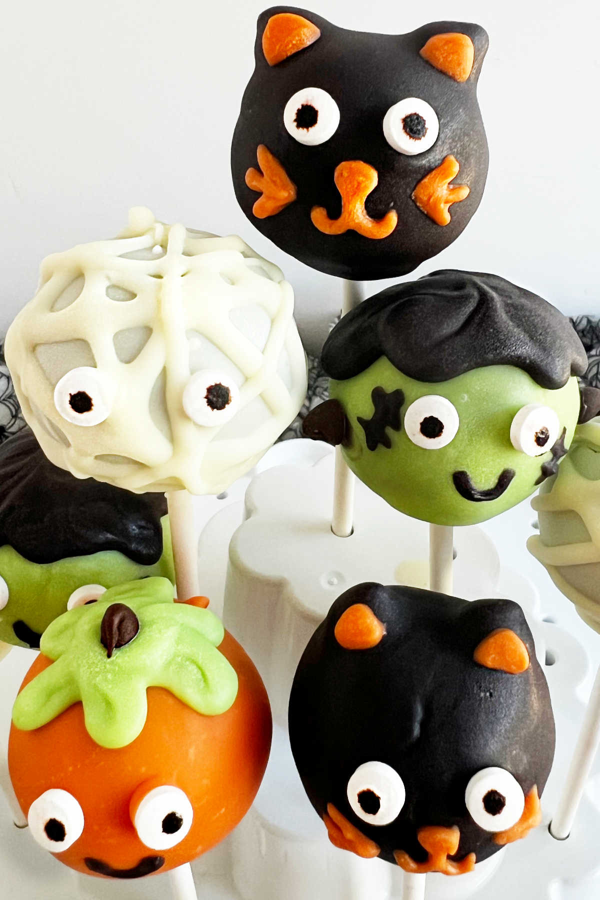 close up of Halloween cake pops in holder.