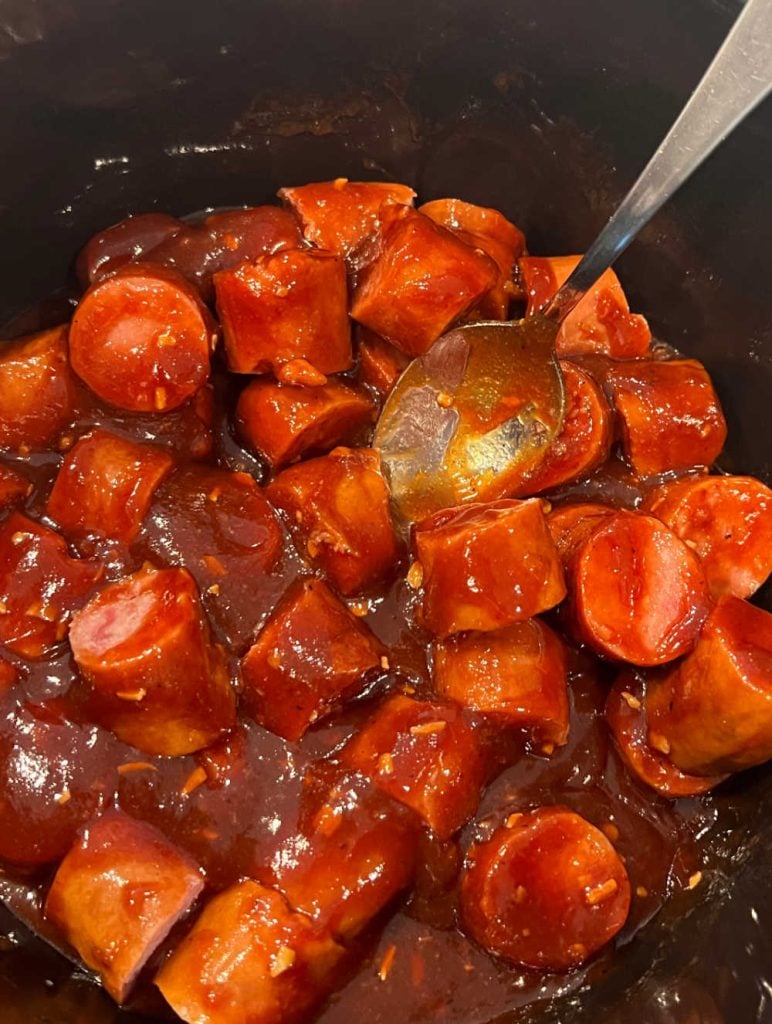 stir smoked sausage and bbq sauce in slow cooker.