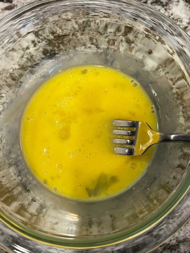 beat eggs with fork in small bowl.