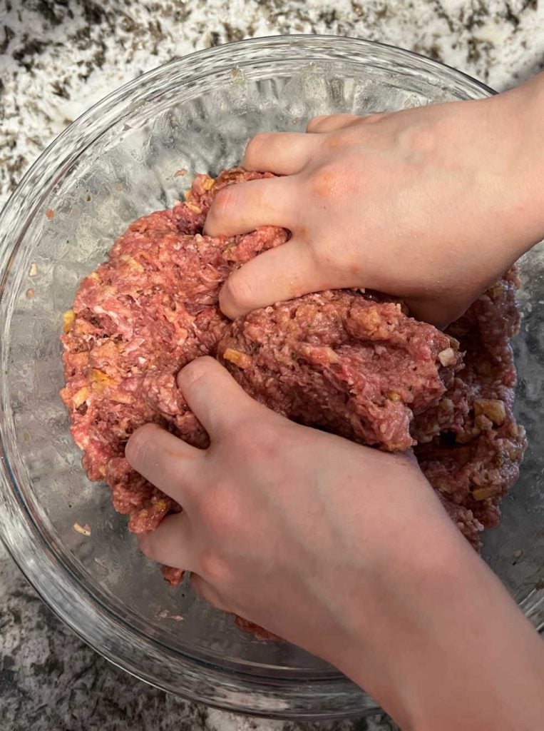 mix meatloaf mixture with hands in large mixing bowl.