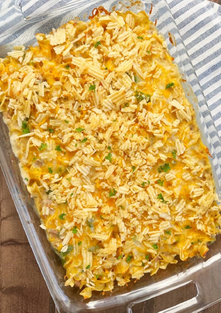 baked tuna casserole with potato chips on table.