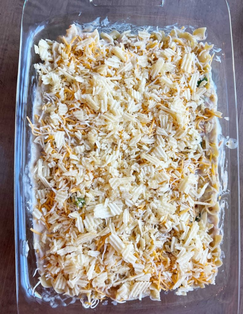 tuna noodle casserole with potato chips in baking dish.