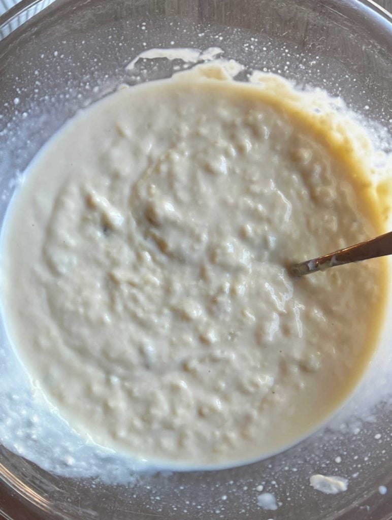 mix cream soups and milk in mixing bowl.