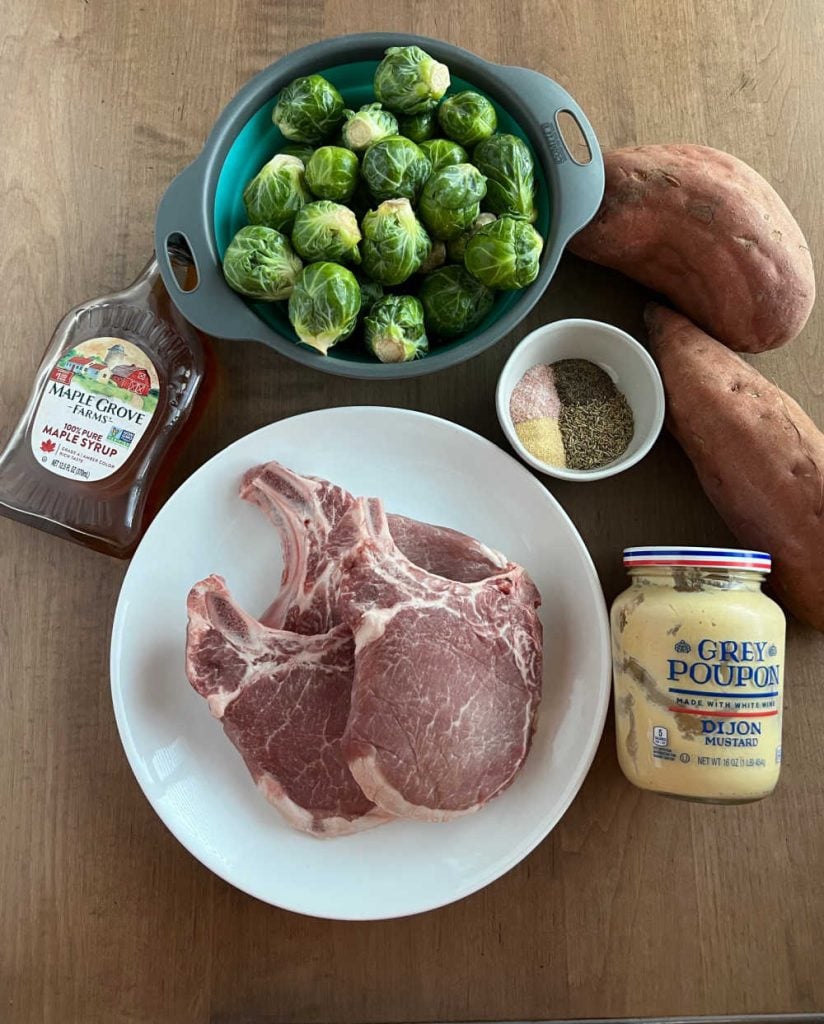 bone-in pork chops, brussels sprouts, sweet potatoes, maple syrup, mustard and seasonings.