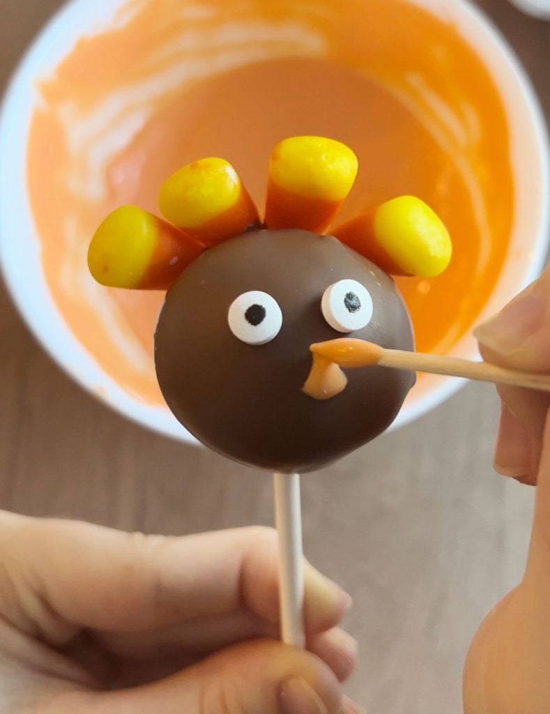 make turkey beak with orange candy coating.