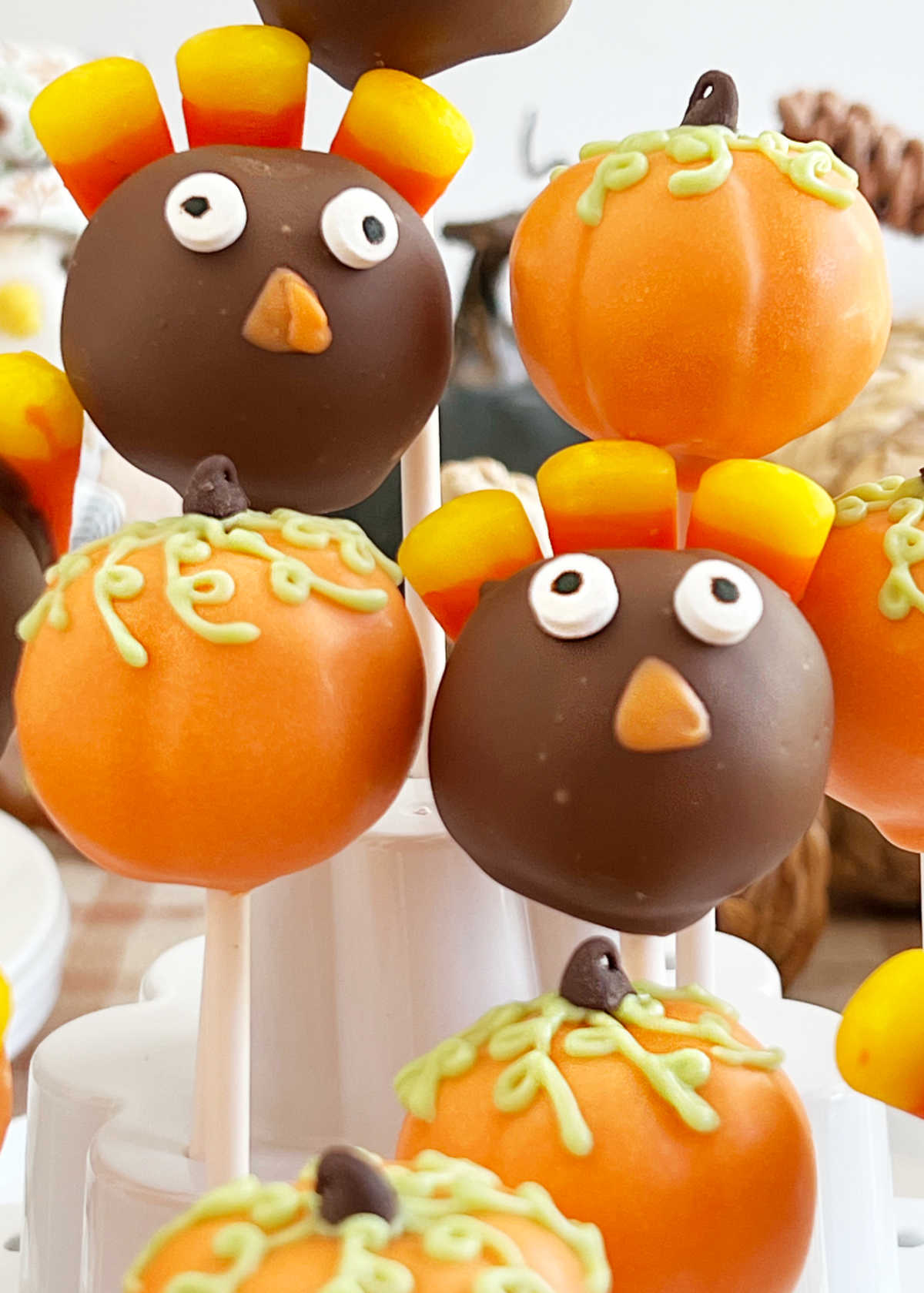 turkey cake pops and pumpkin cake pops on thanksgiving table
