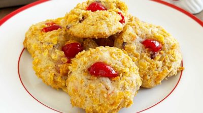 cherry wink cookies with cornflakes on plate.