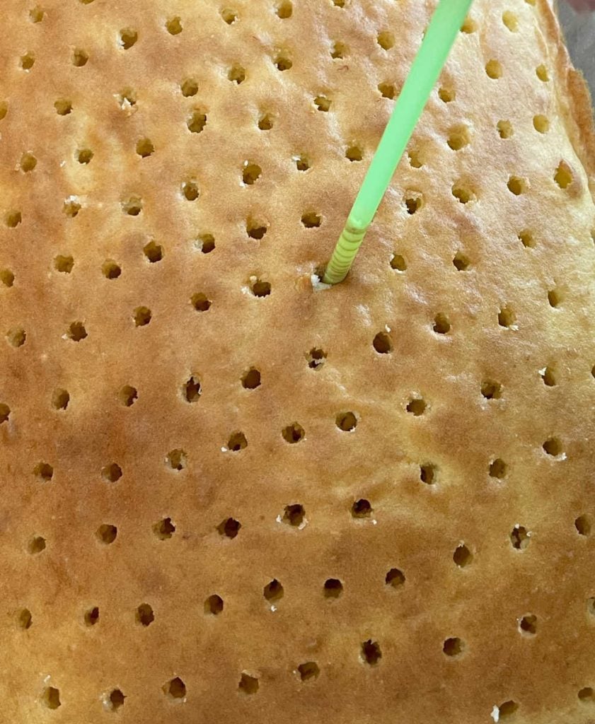 poke holes in cake with straw.