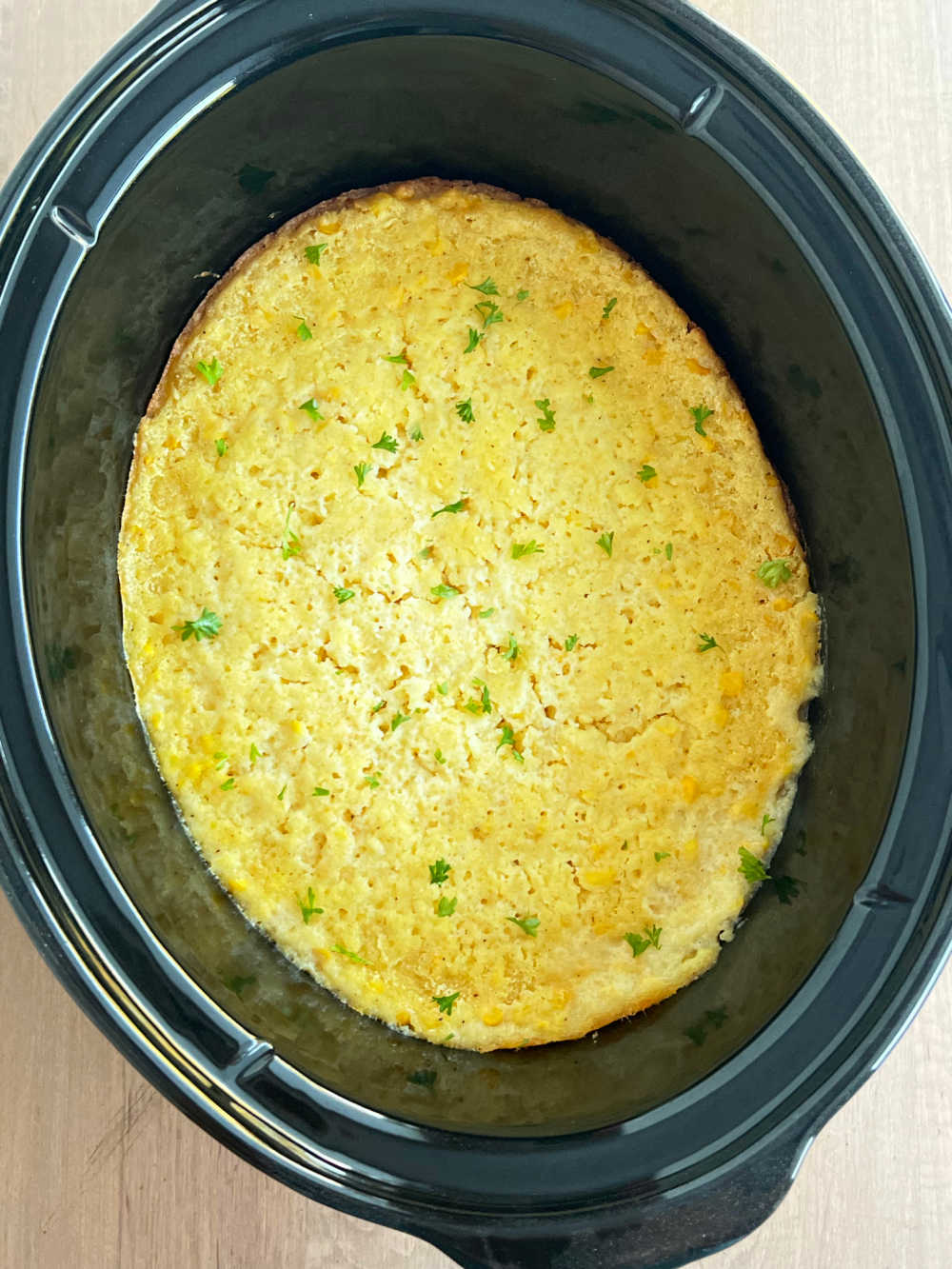 Jiffy crock pot corn casserole in slow cooker.