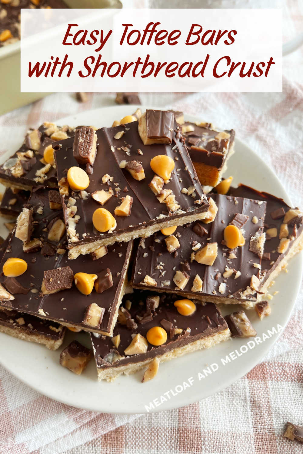 Easy Toffee Bars have a buttery brown sugar shortbread crust topped with melted chocolate, butterscotch chips and toffee bits. An easy dessert recipe perfect for the holiday season! via @meamel