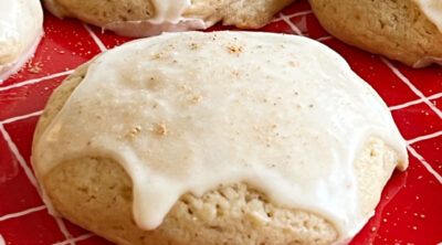 glazed eggnog cookies on a red plate.