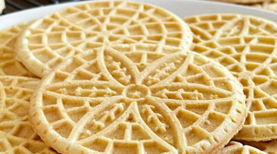 pizzelle cookies stacked on the table.