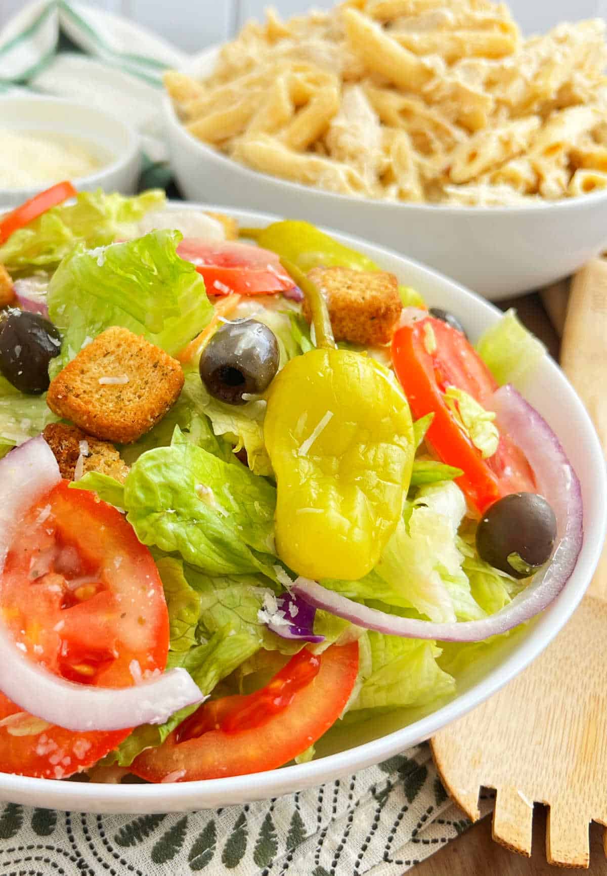 serving bowl of salad like olive garden makes with pasta.