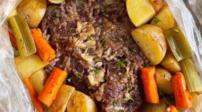 beef pot roast cooked in an oven bag with onion soup mix, carrots, potatoes and celery.