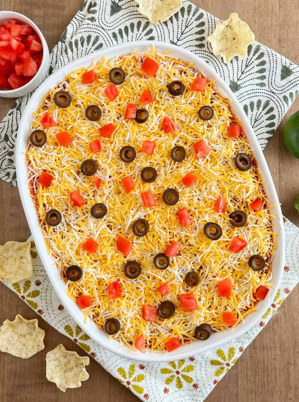 7 layer dip in a white baking dish.