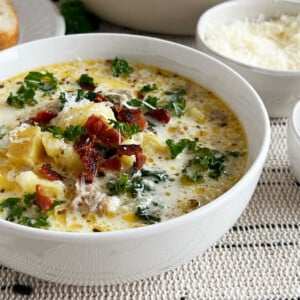 bowl of zuppa toscana soup with kale and bacon