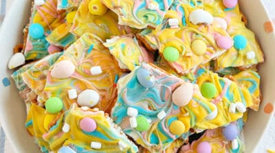 pastel colored Easter bark with mini eggs, marshmallow bits and pretzels.