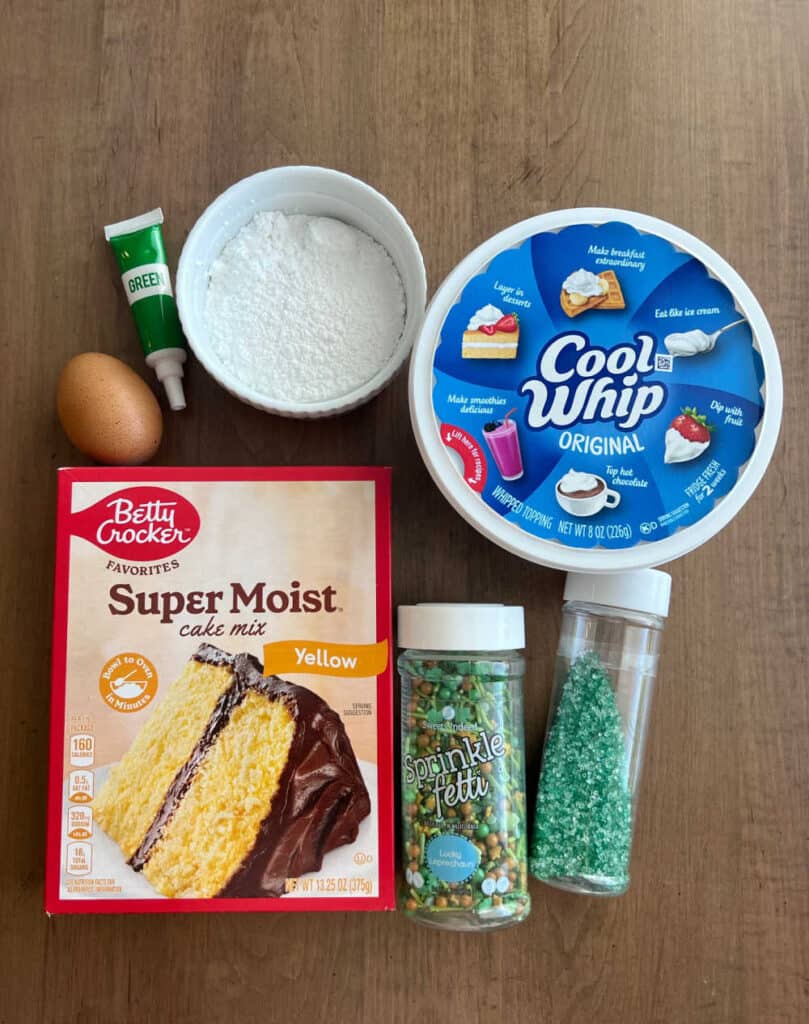 yellow cake mix, cool whip, egg, green food coloring, powdered sugar.