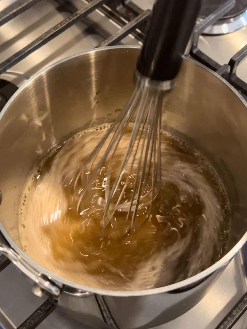 whisk glaze ingredients in pot on the stove.