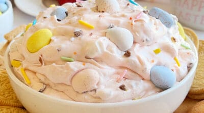 cadbury mini eggs dip in white bowl with dippers.