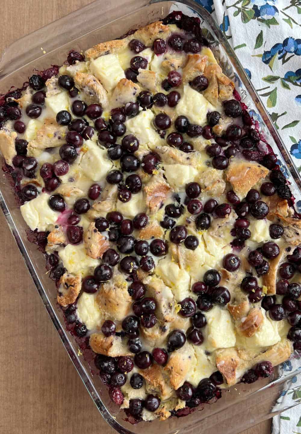 blueberry bagel french toast casserole in baking dish.