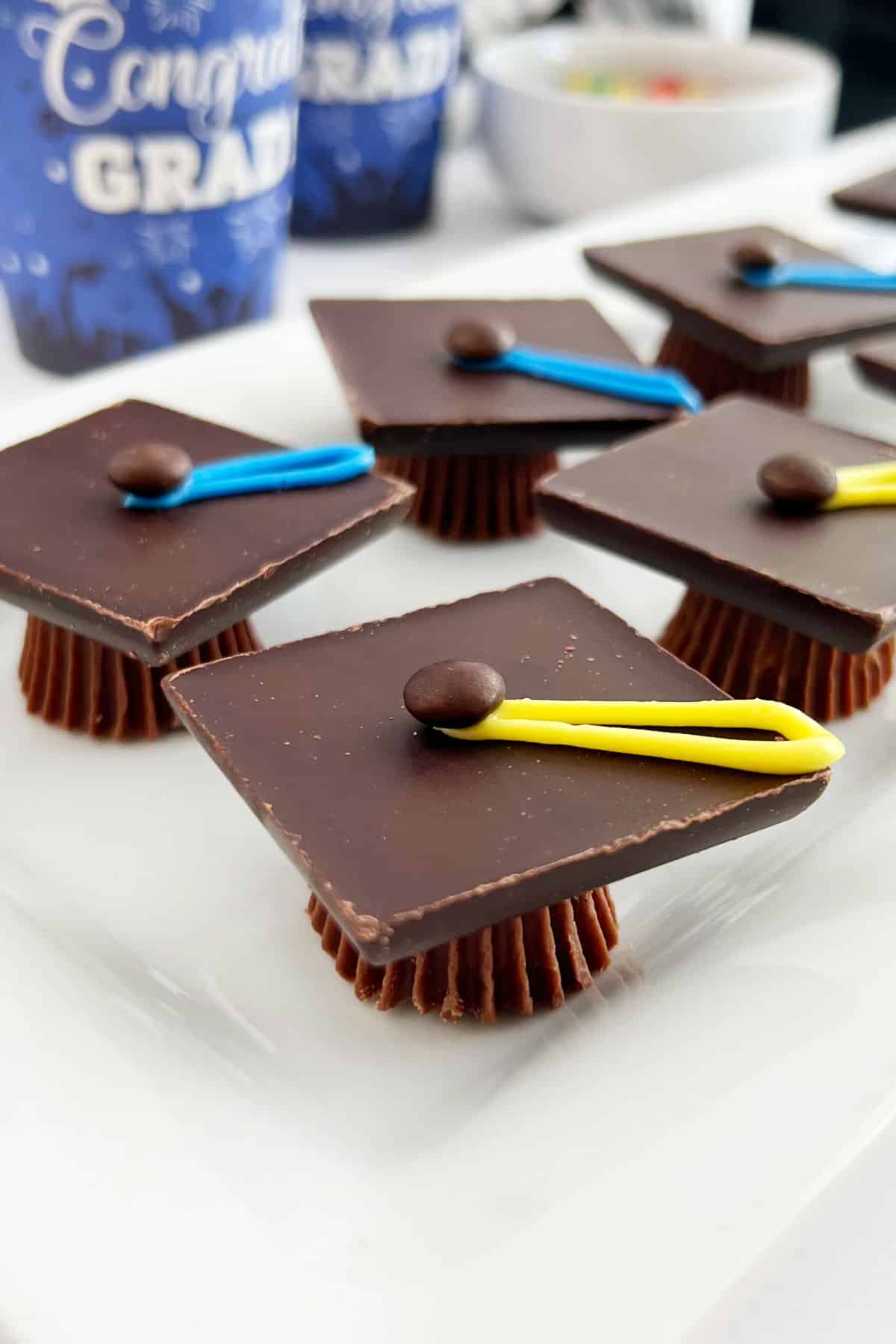 chocolate graduation caps treats on a platter at grad party.