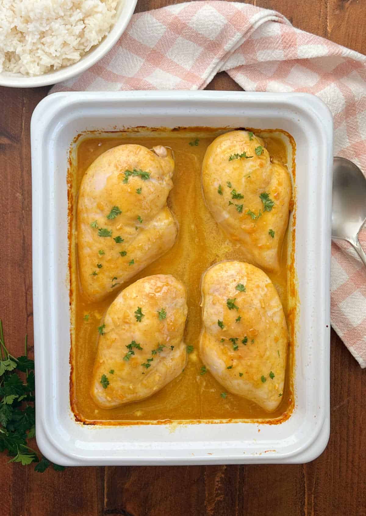 baked honey curry chicken with rice on the table.