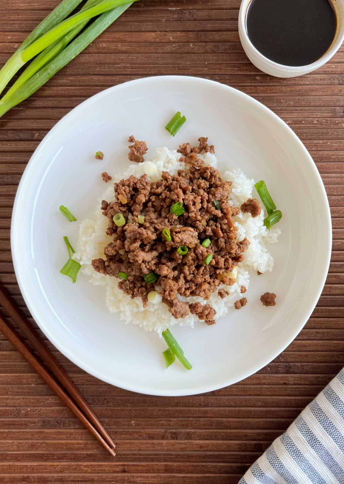 Korean ground beef bowl with rice and green onions.