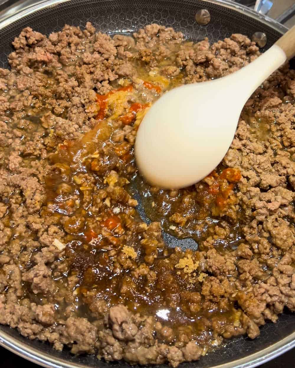 stir sauce ingredients into beef.
