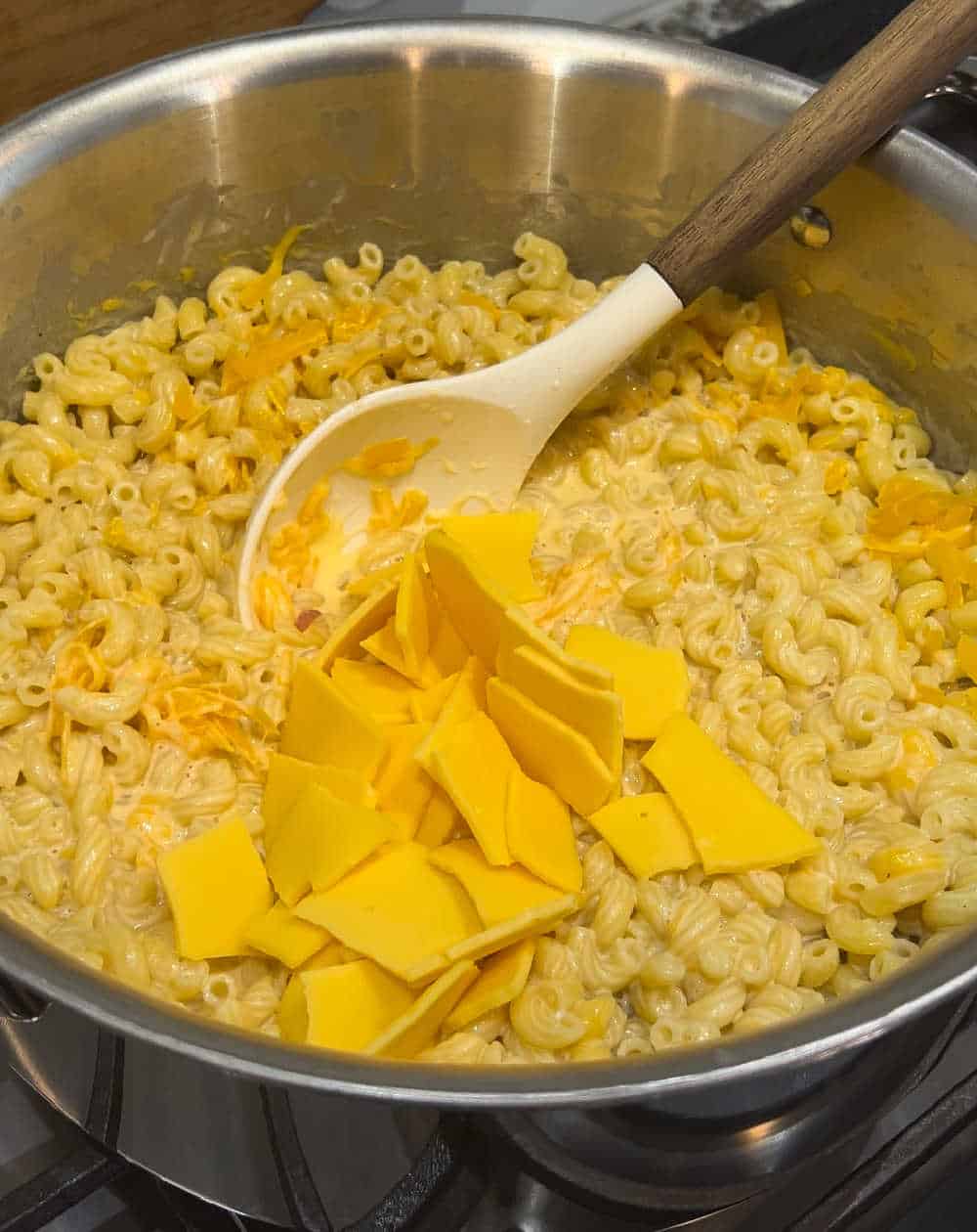 add cheese to macaroni.
