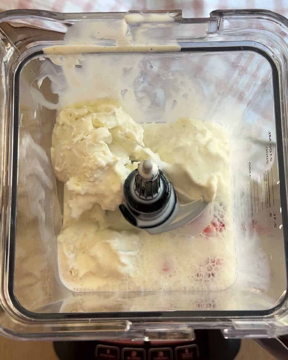 blend milkshake ingredients in blender.