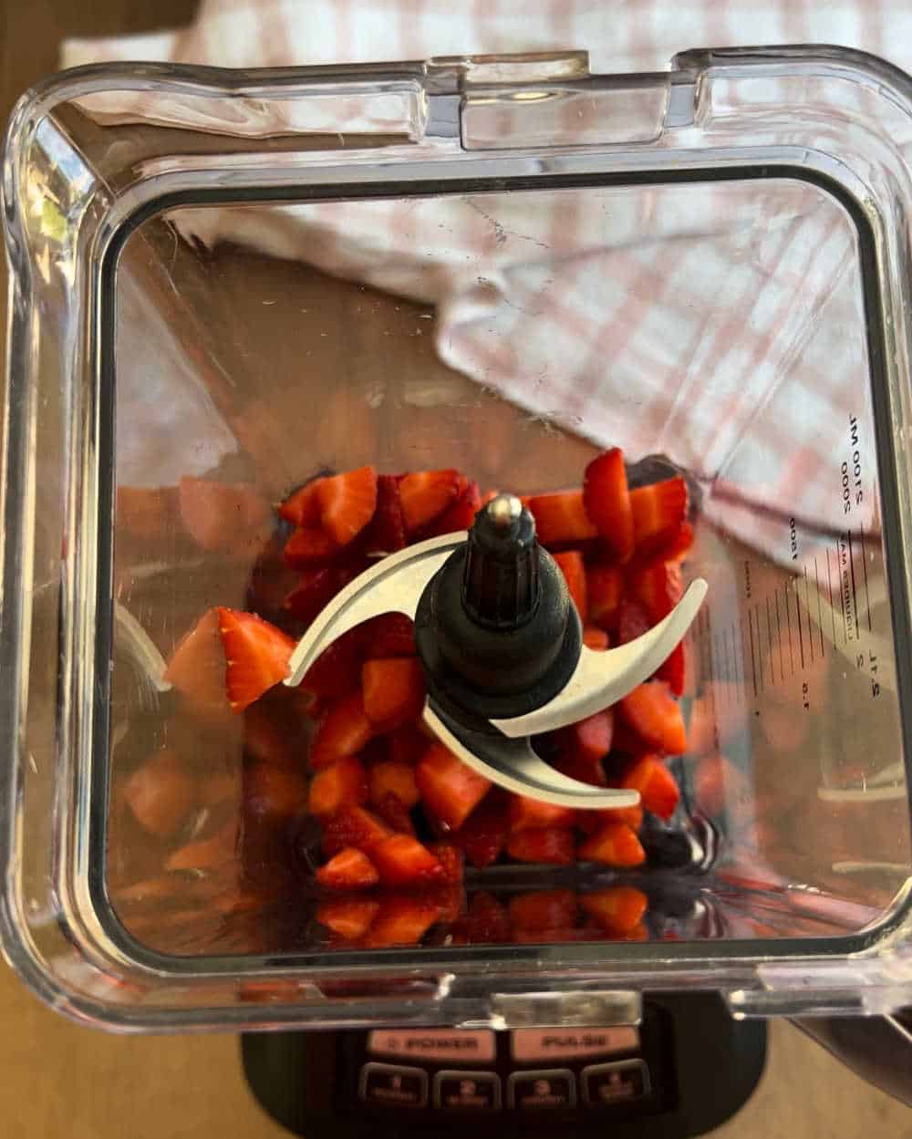 sliced strawberries in blender.