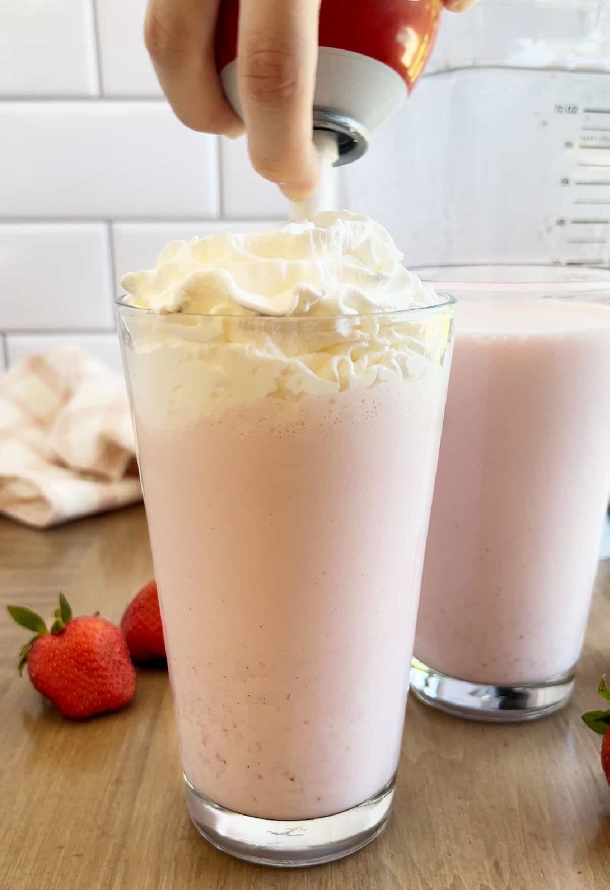Reddi-Wip on strawberry milkshake.