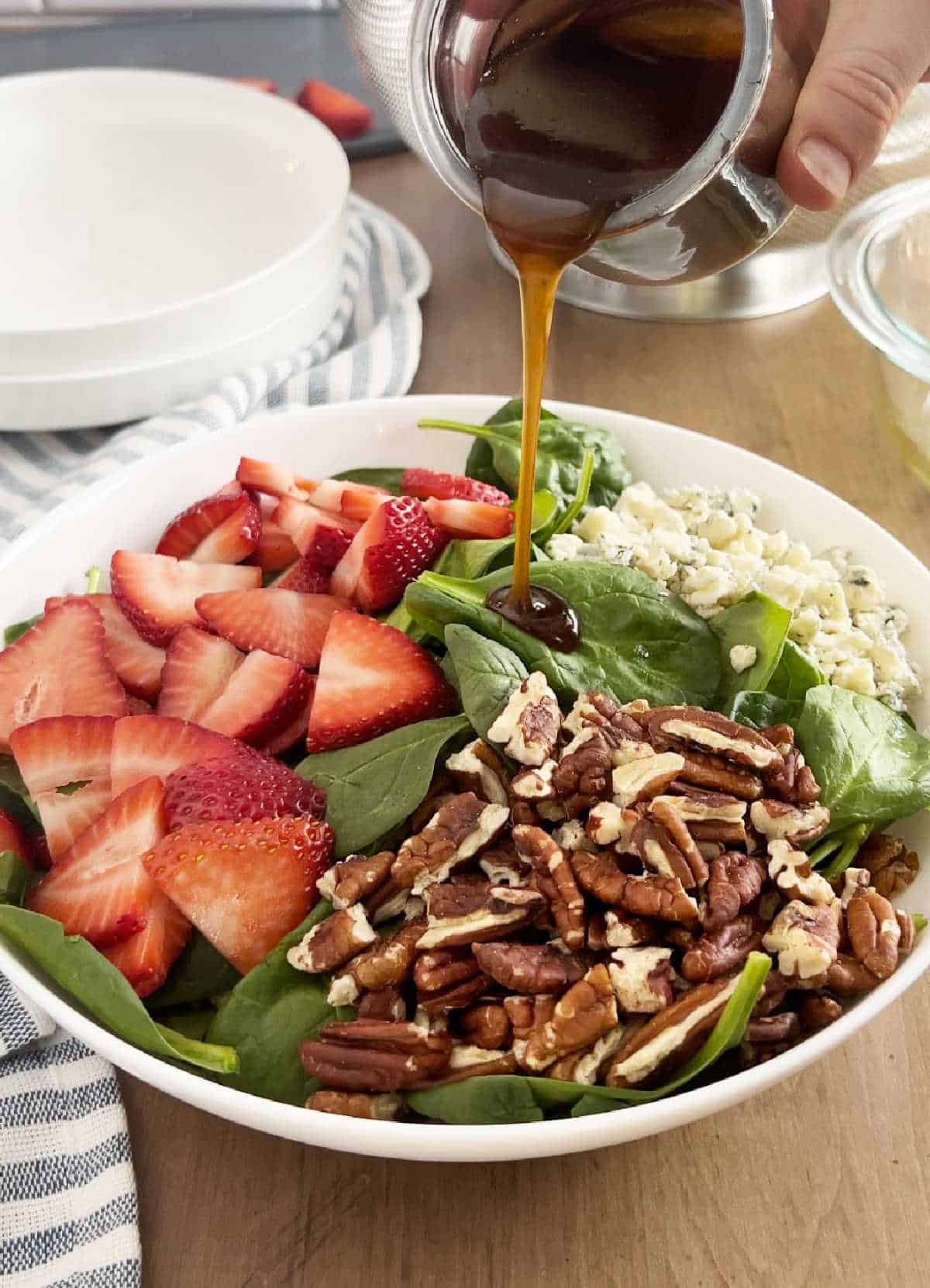 pour balsamic dressing over salad.