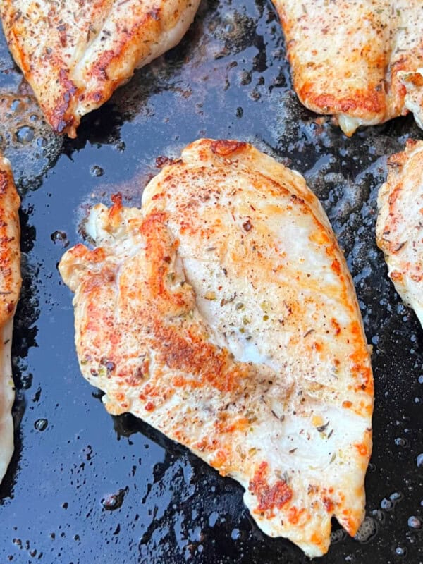 grilled chicken breasts on blackstone griddle.