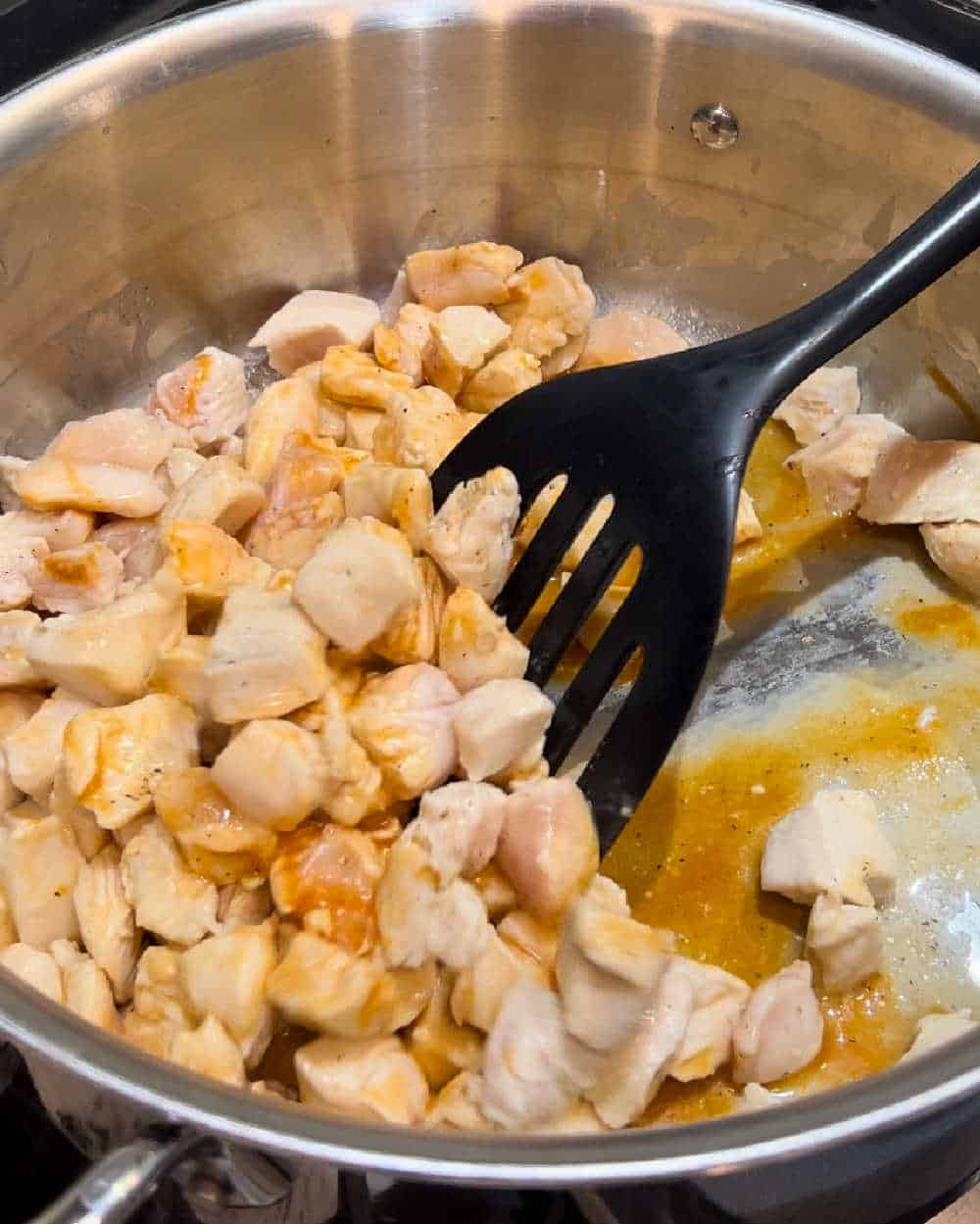 cook chicken pieces in buffalo sauce.