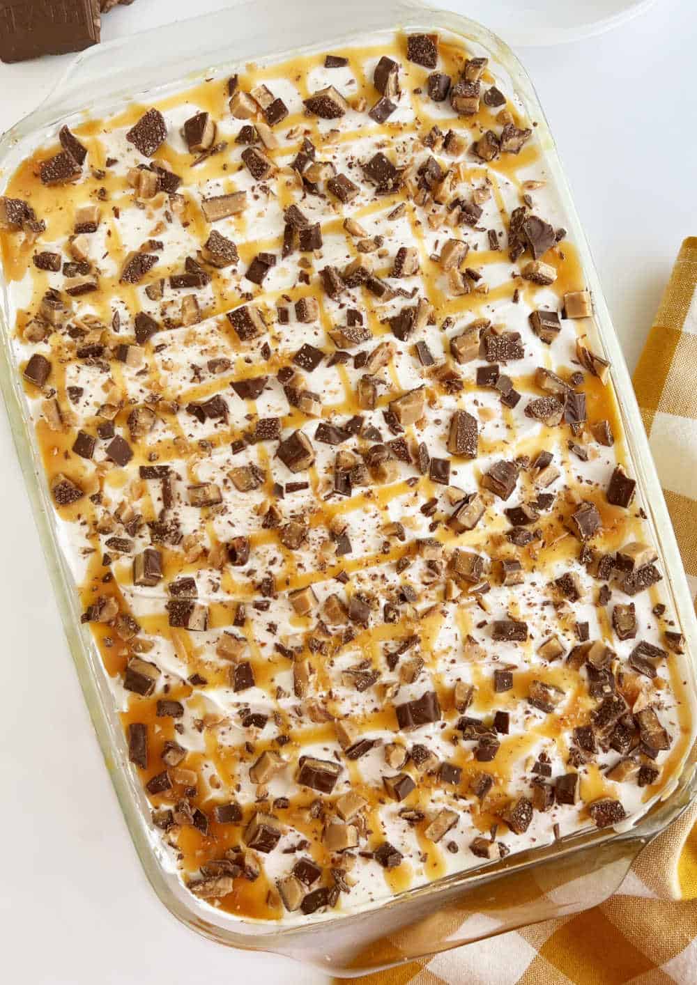 Heath bar poke cake in baking dish.