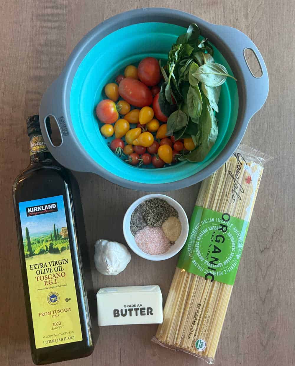 fresh yellow and red tomatoes, basil, spaghetti, butter, garlic, olive oil and seasonings.